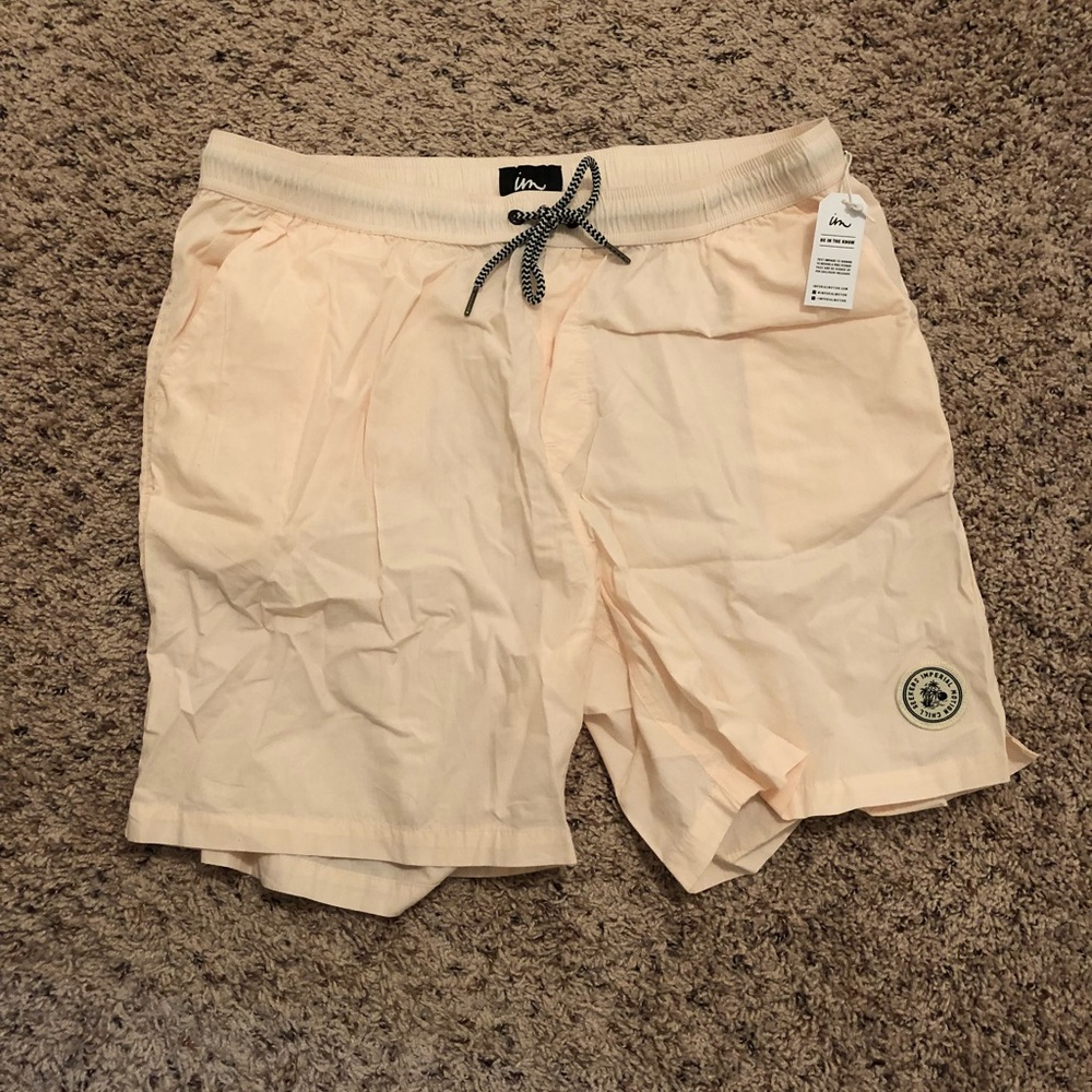 Men’s light pink swim trunks